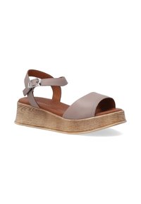Leren open-teensandalen in lichtbruin met een houten, gestructureerde sledehak. Voorzien van een enkelband met een zilveren gesp.