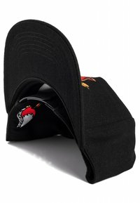 Black baseball cap with a curved visor, featuring colorful embroidered graphics, textured fabric, and a subtle pattern on the underside of the visor.