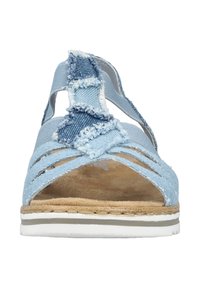 Light blue denim sandal with frayed accents, open design, and a cushioned brown footbed. Features a white and gray striped sole.