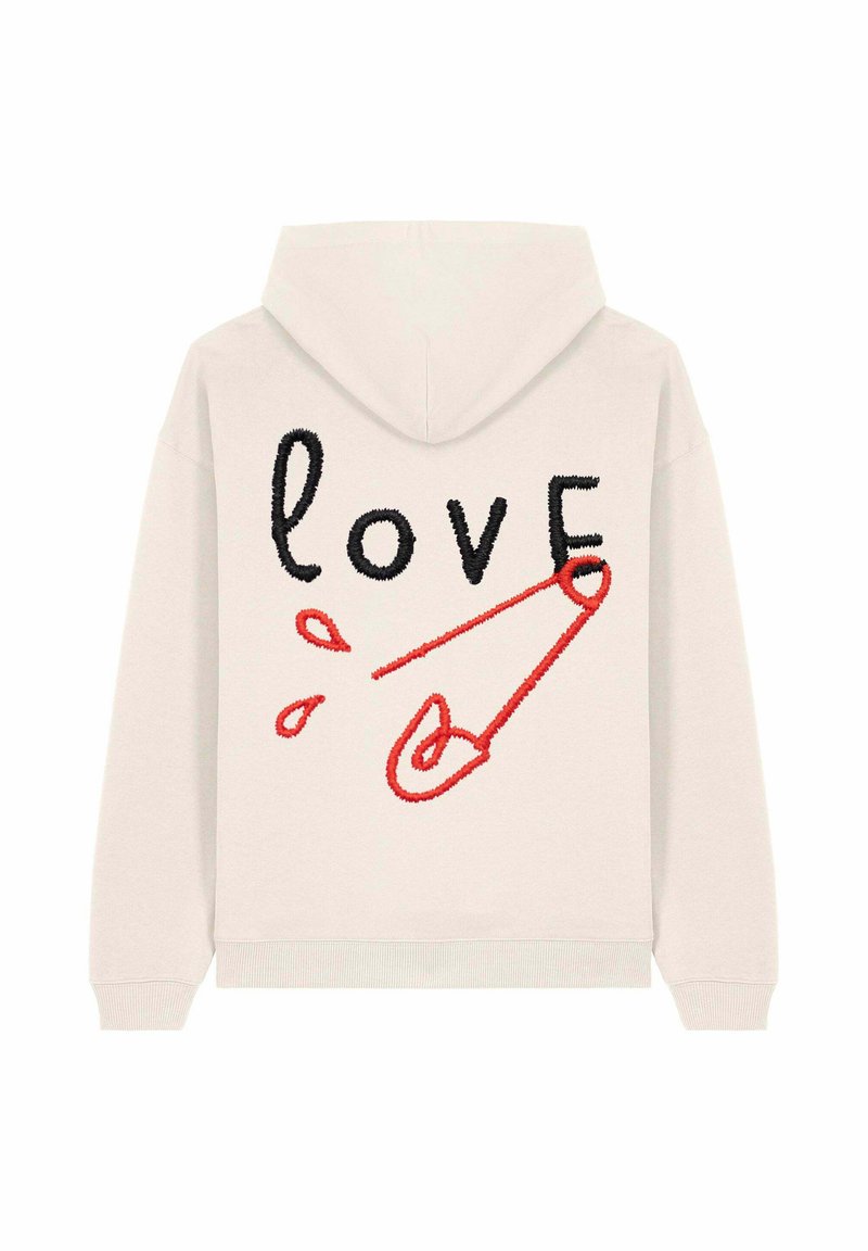 Felpa crema con ricamata la parola "love" in nero e una grafica di una spilla di sicurezza rossa sul retro. Tessuto morbido con vestibilità rilassata.