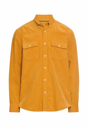 Long-sleeve button-up shirt in mustard yellow corduroy. Features two chest pockets and a collar. Smooth texture with a classic fit.