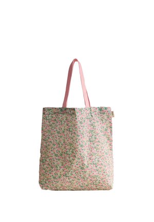 Torba wielokrotnego użytku z różowym kwiatowym wzorem i jednolitymi różowymi uchwytami, o prostokątnym kształcie, wisząca na białym tle.