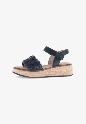 Zwarte gevlochten leren sandals met een kurken wigzool. Bevat een enkelband en een getextureerde voetbed voor comfort.
