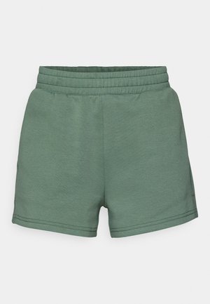 Gröna bomullsshorts med elastisk midja, med en slät textur och enkel design, som slutar ovanför knäet utan synliga fickor.