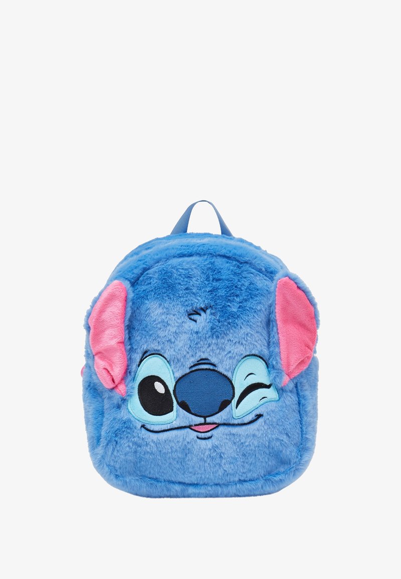 Sac à dos en peluche bleu en forme de personnage de dessin animé, avec des oreilles roses, de grands yeux et une expression souriante ; texture douce et design arrondi.