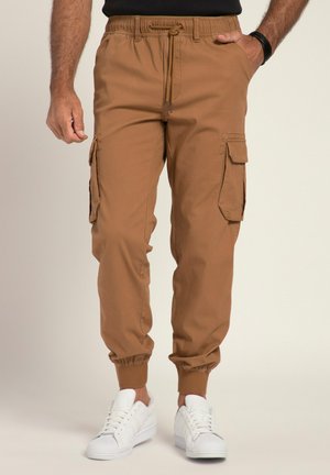 Cargo-Hosen in einem warmen Braunton, mit elastischem Bund, Kordelzug, Seitentaschen und elastischen Bündchen; aus einem leichten Stoff gefertigt.