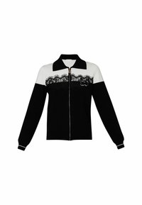 Black and white zip-up cardigan with a collared neck, long sleeves, and black lace detailing across the chest. Soft knit material.