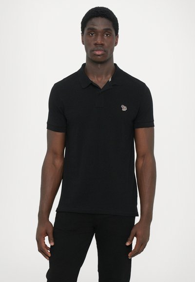Black polo shirt made of cotton, featuring a classic collar and short sleeves. Includes a small colored logo on the chest.