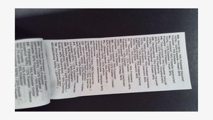 Clothing care label with multi-language text detailing fabric composition: 78% recycled polyester, 22% elastane, various language specifications.