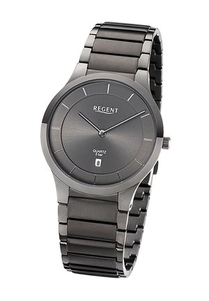 Montre à quartz avec un boîtier et un bracelet en métal gris foncé. Présente un cadran minimaliste avec des index horaires et un affichage de la date. ACCENT : logo REGENT.