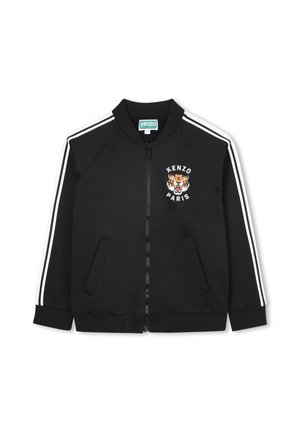 Veste bomber noire en tissu lisse. Présente des rayures blanches sur les manches, un logo de tigre, une fermeture éclair et deux poches latérales.