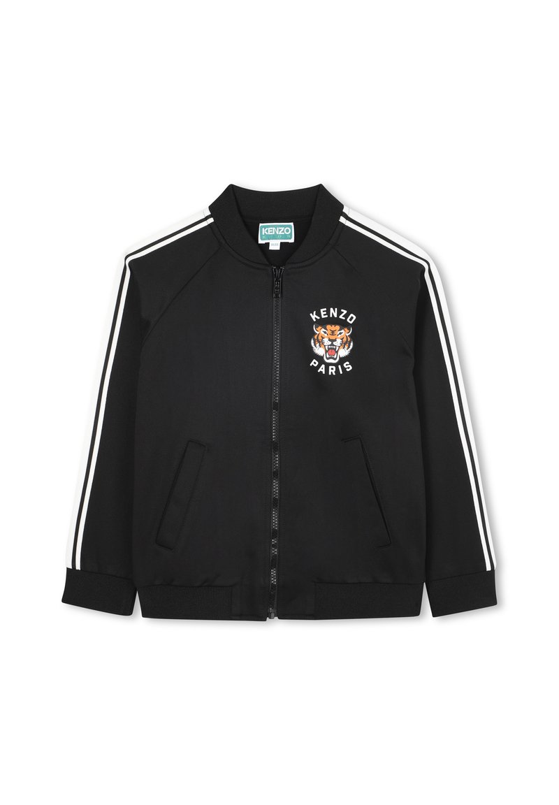 Giacca bomber nera in un tessuto liscio. Presenta strisce bianche sulle maniche, un logo a forma di tigre, chiusura con zip e due tasche laterali.