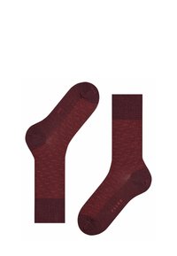 Calzini bordeaux con motivo a fantasia, design testurizzato, polsini a coste e finitura liscia. Dettaglio del logo vicino al polsino.