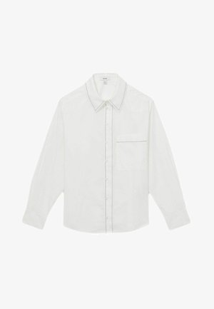 White long-sleeve shirt made of cotton, featuring a pointed collar, button front closure, single chest pocket, and contrasting black stitching accents.