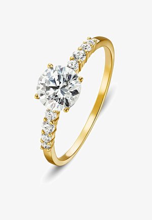 Goldring mit einem großen runden klaren Diamanten als zentralem Stein und sechs kleineren runden Diamanten, die beidseitig des Ringschafts gesetzt sind.