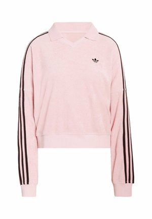 Różowy, krótki pulower z teksturowanej tkaniny, z dekoltem w literę V i czarnymi paskami na rękawach. Posiada haftowane logo na piersi.