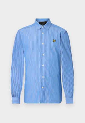 Kék-fehér csíkos gombos ing hosszú ujjakkal, bal mellrészen kis sárga logóval, szabványos gombzárral.
