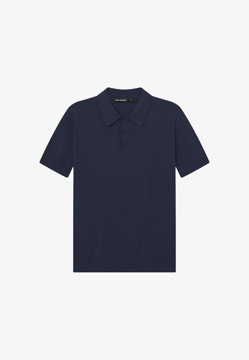 Polo manches courtes bleu marine avec col et patte de boutonnage à trois boutons, avec une broderie de logo discrète sur la poitrine.