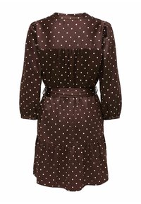 Robe marron à manches longues avec pois blancs, ceinture froncée à la taille et ourlet volanté, vue de dos.