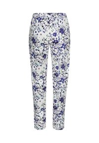Floral print pants featuring a white background with purple and blue flowers, lightweight fabric, elastic waistband, and tapered legs.