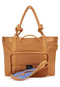 Mellanmörk brunt tote bag med dubbla rephandtag, framfickan med dragkedja delvis öppen och visar ett blått mönstrat foder och ett nätfack.