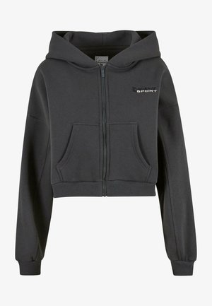 Skratená šedá mikina z mäkkého materiálu, s predným zipsom, dvoma vreckami a kapucňou. Na ľavej hrudi je natlačené športové logo.