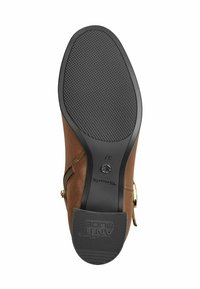 Brown leather ankle boot with a textured black rubber sole, side zip closure, and logo detail near the heel. Size marked as 37.