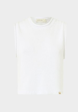 Balta be rankovių megzta palaidinė su apvaliu kaklu, išraižytu apvadu ir šoninėmis siūlėmis; apačioje yra mažas prekinis ženklas.