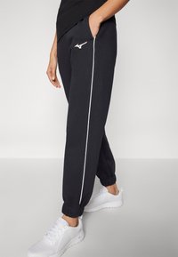 Mizuno ATHLETICS PANT - Treniņtērpa apakšdaļas - black