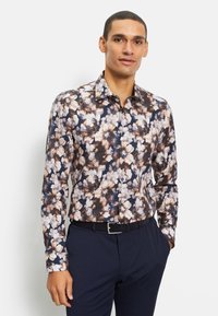 Bloemdruk overhemden met een marineblauwe achtergrond en witte en beige bloemen. Katoenen stof met een slim fit en klassieke kraag.