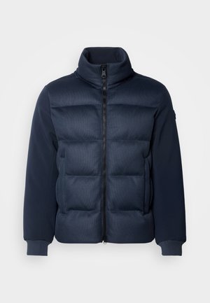 Námornícka páperová bunda s prešívaným predným dielom, vysokým golierom a hladkými rukávmi. Zips na uzatváranie a rebrované manžety. Textúrované dizajnové prvky po celom obvode.