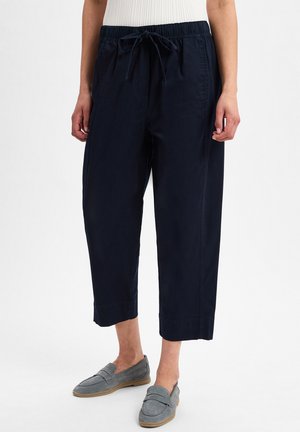 Marineblaue, cropped Hosen aus leichtem Material, mit einem elastischen Bund und Kordelzug. Gerade Beinform mit Seitentaschen.