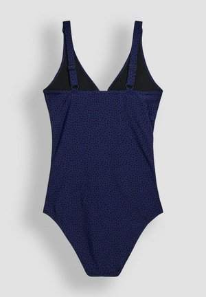 Badeanzug in Marineblau mit schwarzen Punkten, ausgestattet mit verstellbaren Trägern, einem V-Ausschnitt-Design und einer glatten Stoffstruktur.