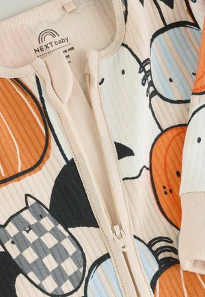 Cream-colored baby onesie featuring cartoon animal prints in orange, blue, and black. Ribbed texture with a front zipper closure.