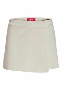 Beige skort met een gladde textuur, voorzien van een zijrits en een subtiel, modern ontwerp. Logotag zichtbaar bij de tailleband.