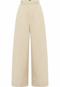 Beżowe spodnie o szerokich nogawkach, wykonane z gładkiego materiału, z wysokim stanem, zapięciem na guzik z przodu oraz szlufkami na pasek.