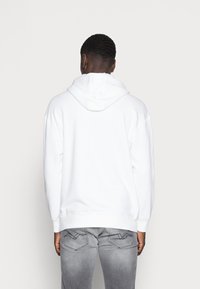 Puma PUMA HARIBO HOODIE - Sportinis megztinis - puma white