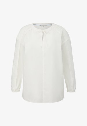 Bela bluza z dolgimi rokavi in okroglim izrezom, z vezanjem spredaj in subtilnimi naborki na ramenskem delu. Gladek bombažni material.