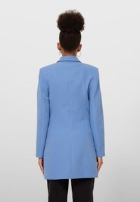 Stradivarius Kort kappa / rock - light blue