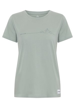 Light green t-shirt made of soft fabric, featuring a mountain line graphic in dark blue across the chest and a logo patch on the hem.