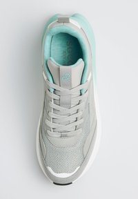 Gray athletic shoe with mesh and smooth textures, contrasting mint accents, six elongated eyelets, and a white sole.