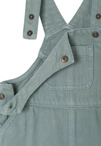 Helle grüne Denim-Overall mit verstellbaren Trägern, Metall-Druckknöpfen und einer Vordertasche. Verfügt über eine strukturierte Oberfläche und horizontale Naht.