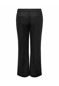 Pantaloni negri, largi, cu talie elastică și două buzunare înguste în spate, văzuți de la spate pe un fundal alb.