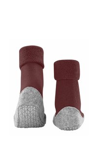 Rote und graue Knöchelsocken mit einem strukturierten Strick-Oberteil und einer weichen, filzähnlichen Ferse, ausgestattet mit einer gummierten Sohle für besseren Halt.