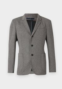 Grau blazer aus strukturiertem Stoff. Verfügt über einen Reverskragen, zwei Fronttaschen, drei Knöpfe und eine taillierte Passform.