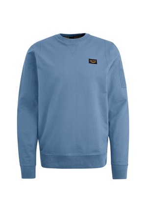 Hellblaues Sweatshirt mit Rundhalsausschnitt, gerippten Bündchen und Saum, ausgestattet mit einem kleinen schwarzen Etikett auf der Brust und einer seitlichen Tasche am Ärmel.