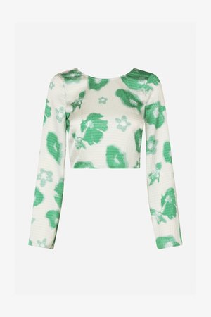 Top corto de manga larga con patrón floral verde, hecho de una tela texturizada y ligera. Escote redondo, diseño ajustado, textura suave.