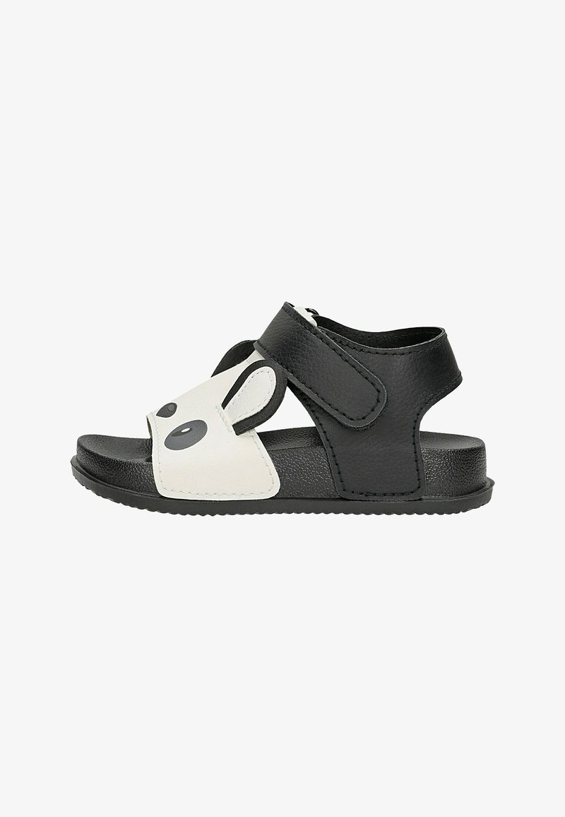 Sandale pour tout-petit noire et blanche avec motif visage de panda, bride ajustable et semelle texturée pour un maintien sûr et un confort optimal.