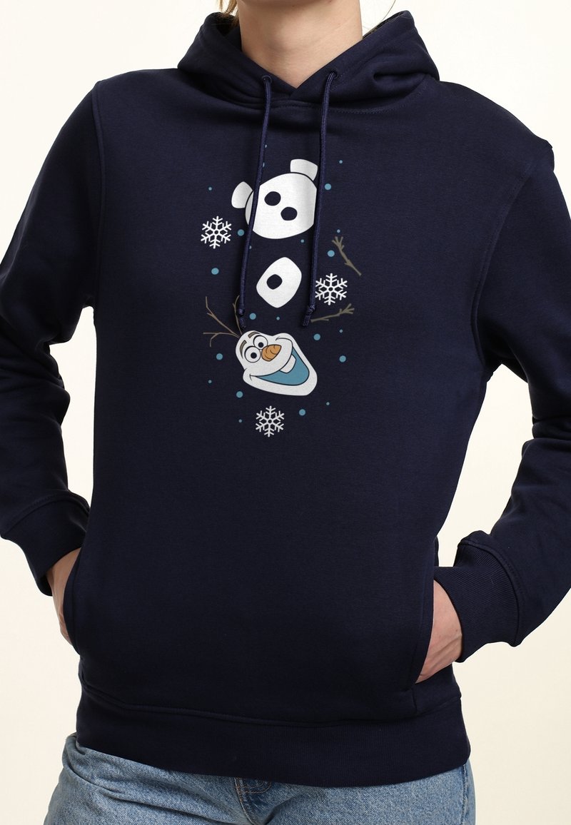 Sweat à capuche bleu marine avec un bonhomme de neige stylisé affichant un visage souriant de dessin animé, des flocons de neige et des bras en bâtons au centre devant.