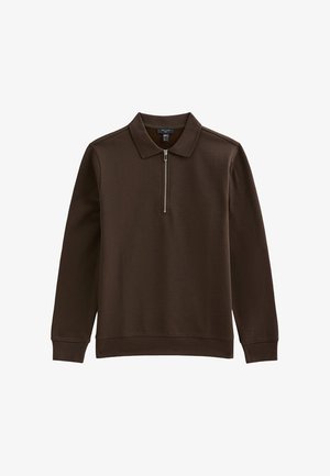 Suéter marrón hecho de un tejido suave y liso, con collar con cremallera, mangas largas y un corte relajado para mayor comodidad.